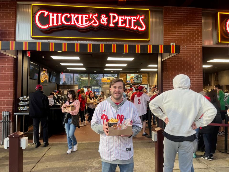 Phillie's fan Mark Cecconi posted up in an endlessly long line for Chickie's and Pete's on May 5, 2023. But he still got his food within 20 minutes, he said. When asked whether he was a fan of Chickie's, Cecconi said "How can you not be if you live in this city?"