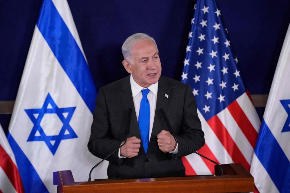 Israeli Prime Minister Benjamin Netanyahu gives statements to the media inside The Kirya, which houses the Israeli Defence Ministry (POOL/AFP via Getty Images)