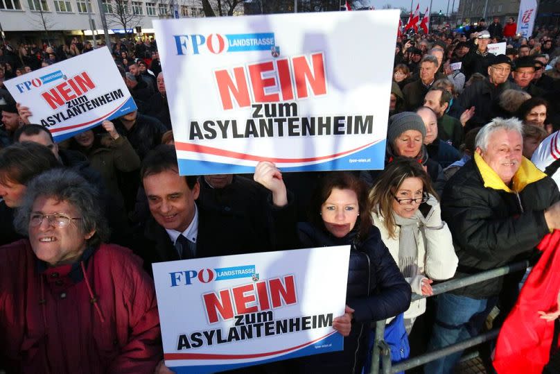 Protesters hold a banner "no for refugee camp" during a demonstration against a refugee camp in Vienna, March 2016