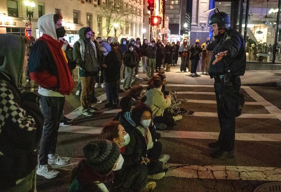 Police and pro-Palestinian supporters face off after the Emerson College Palestinian protest camp was cleared by police in Boston (AFP via Getty Images)