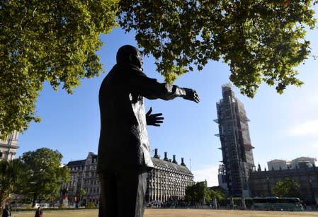 General view of the Houses of Parliament with the statue of Nelson Mandela in the foreground, in London