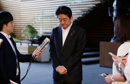 Japan's Prime Minister Shinzo Abe bows as he speaks to the media at his official residence in Tokyo, Japan July 28, 2017. REUTERS/Toru Hanai