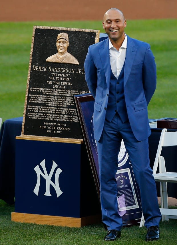 Former New York Yankees great, Derek Jeter stands in front of his plaque during a pregame ceremony honoring Jeter and retiring his number 2 at Yankee Stadium on May 14, 2017, in New York City.<p><a href="https://www.gettyimages.com/detail/683660166" rel="nofollow noopener" target="_blank" data-ylk="slk:Rich Schultz/Getty Images;elm:context_link;itc:0;sec:content-canvas" class="link ">Rich Schultz/Getty Images</a></p>
