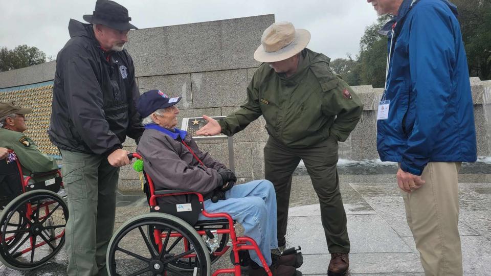 World War II veteran Eugene Jaroslaw of Asheville talks with a volunteer at the World War II Memorial on Oct. 14 in Washington, D.C. Jaroslaw was the only World War II veteran aboard the Oct. 14 Blue Ridge Honor Flight.