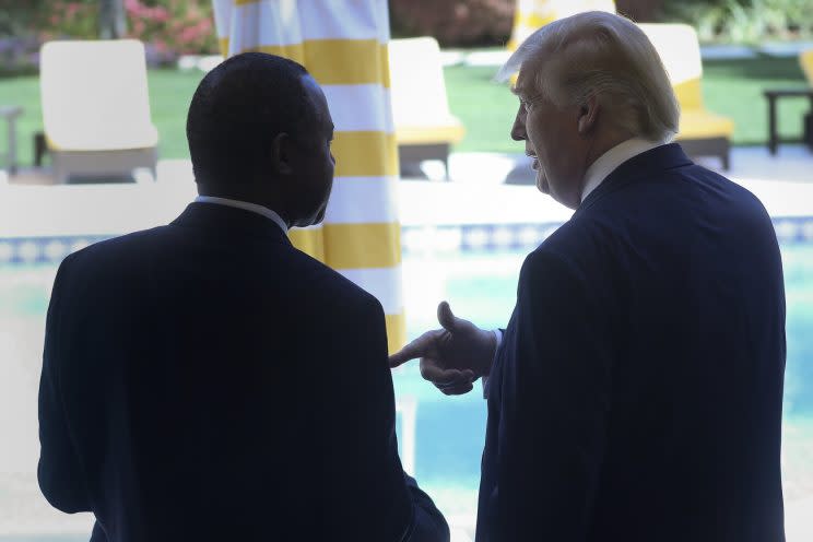 Ben Carson and Donald Trump speak at a campaign event in Palm Beach, Fla., on March 11, 2016. (Carlo Allegri/Reuters)