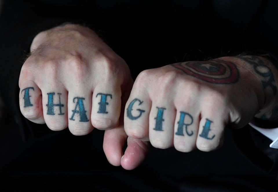 Sean Woodard had this tattoo placed on his fingers to honor his fiancé  Amanda DiMarzio, who’s is battling a rare form of cancer. Wednesday, Dec. 4, 2019, in Nashville, Tenn.