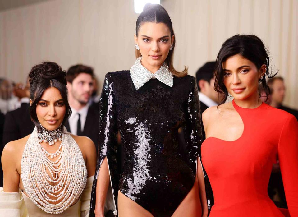 Matt Winkelmeyer/MG23/Getty Kim Kardashian, Kendall Jenner and Kylie Jenner pose together at the 2023 Met Gala.