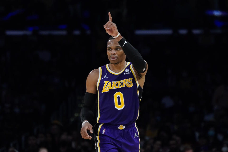 Los Angeles Lakers' Russell Westbrook gestures while walking on the court during the first half of the team's NBA basketball game against the Cleveland Cavaliers on Friday, Oct. 29, 2021, in Los Angeles. (AP Photo/Jae C. Hong)