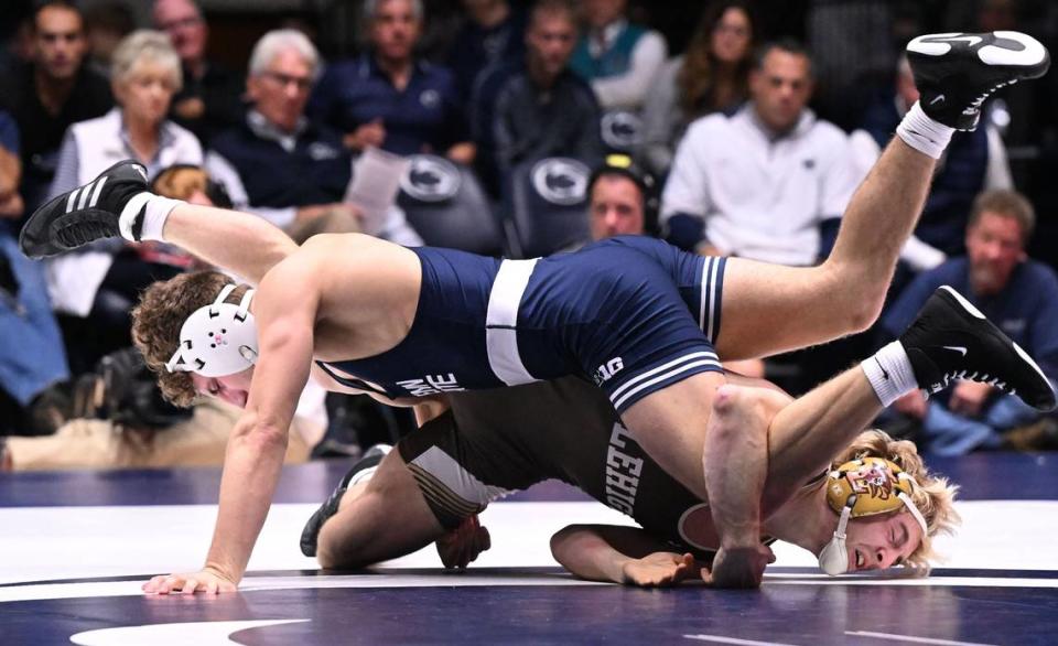 Penn State’s Mitchell Mesenbrink takes down Lehigh’s Jake Logan (165 lbs) during Sunday’s match at Rec Hall at Penn State. Mesenbrink won by tech fall (18-2). Penn State defeated Lehigh, 30-10.