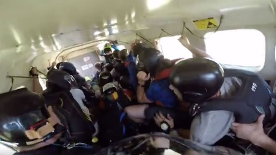 The 17 passengers inside the skydiving plane can be seen bracing themselves for a crash-landing in a  California vineyard on Friday.Photo: YouTube