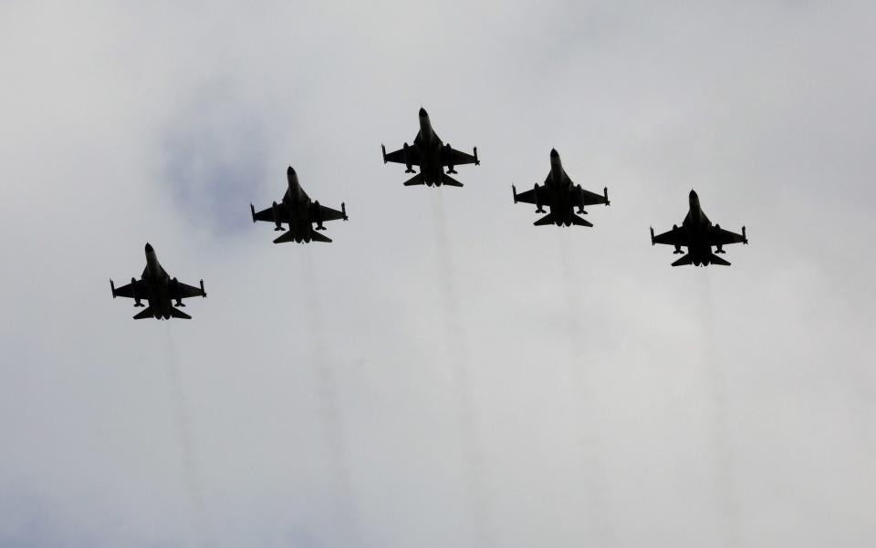 Taiwanese F-16 fighter jets fly in formation - Ann Wang/Reuters
