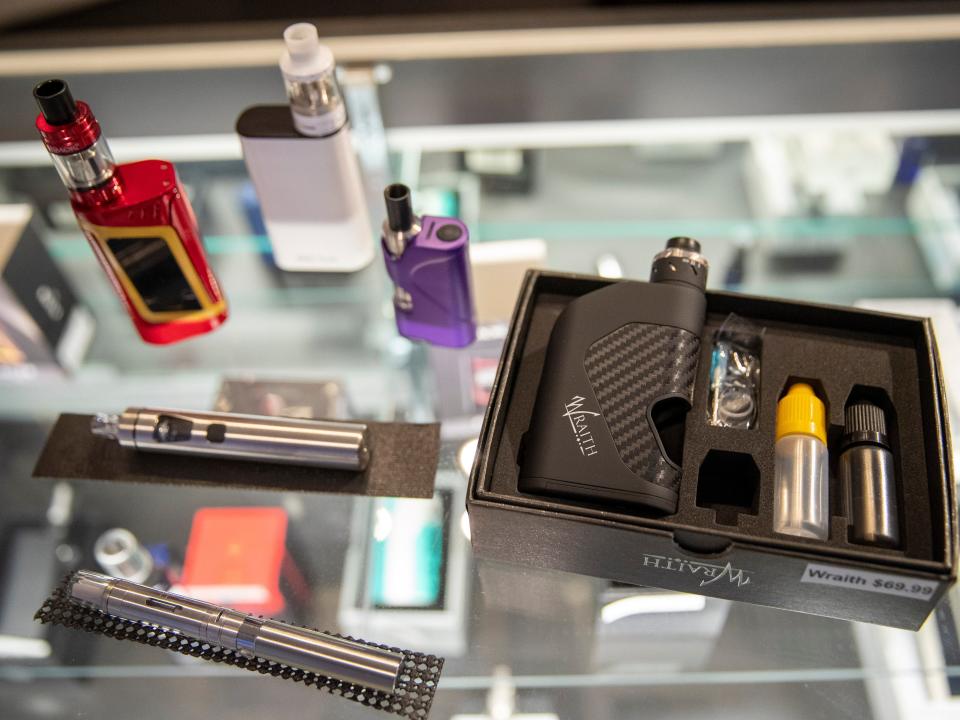 FILE - In this Thursday, Jan. 2, 2020 file photo, vaping devices are displayed at a store in New York. On Thursday, April 23, 2020, the U.S. Food and Drug Administration said that a federal court accepted its request to push back the May 12 deadline to submit vaping product applications to Sept. 9. The agency said the COVID-19 pandemic has delayed preparations to meet the deadline for both companies and FDA staff. (AP Photo/Mary Altaffer)