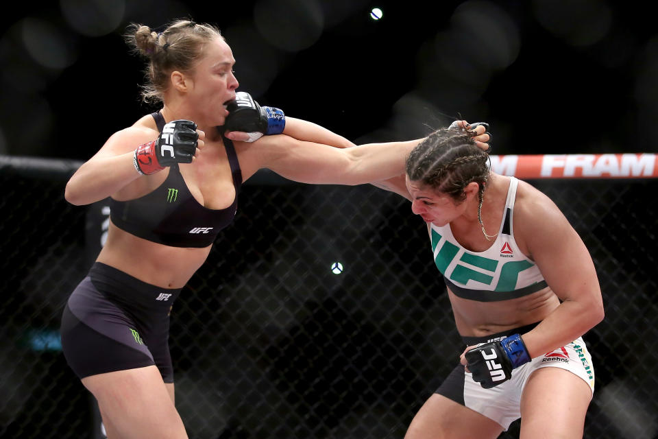 RIO DE JANEIRO, BRAZIL - AUGUST 01:  Ronda Rousey of the United States (red) fights Bethe Correia of Brazi (blue) l in their bantamweight title fight during the UFC 190 Rousey v Correia at HSBC Arena on August 1, 2015 in Rio de Janeiro, Brazil.  (Photo by Matthew Stockman/Getty Images)