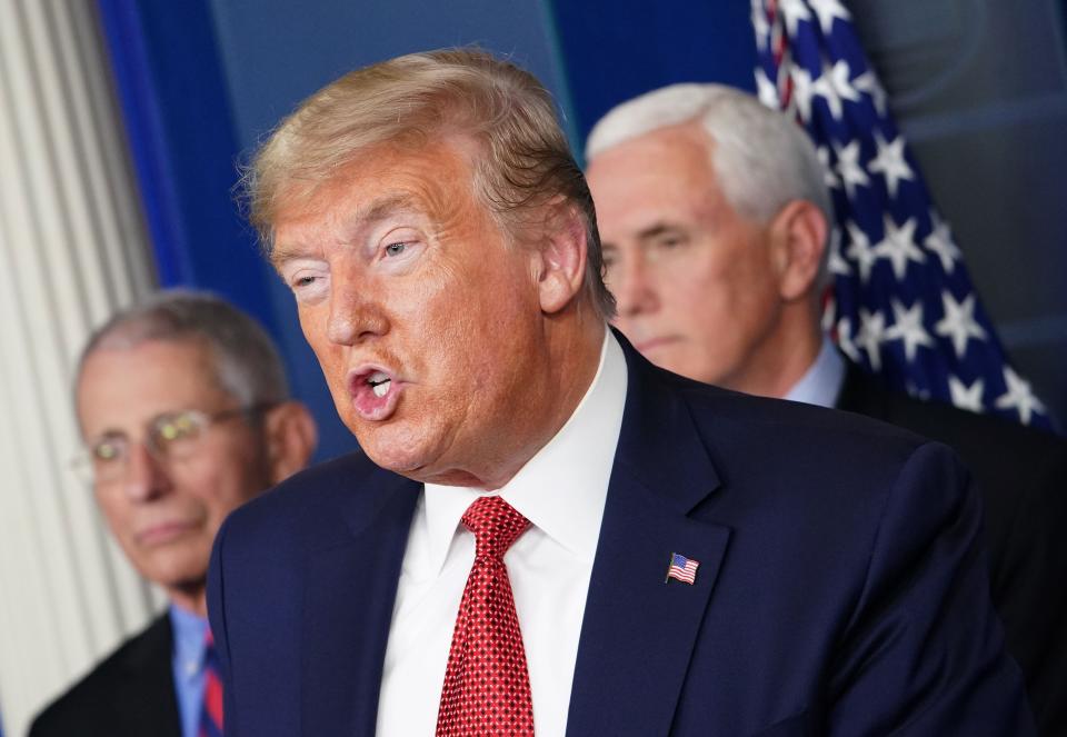 President Donald Trump speaks during the daily briefing on the novel coronavirus, COVID-19, as Director of the National Institute of Allergy and Infectious Diseases Anthony Fauci and Vice President Mike Pence look on at the White House on March 25, 2020, in Washington.