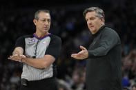 Minnesota Timberwolves head coach Chris Finch, right, talks with referee J.T. Orr during the first half of an NBA basketball game against the Orlando Magic, Friday, Feb. 3, 2023, in Minneapolis. (AP Photo/Abbie Parr)