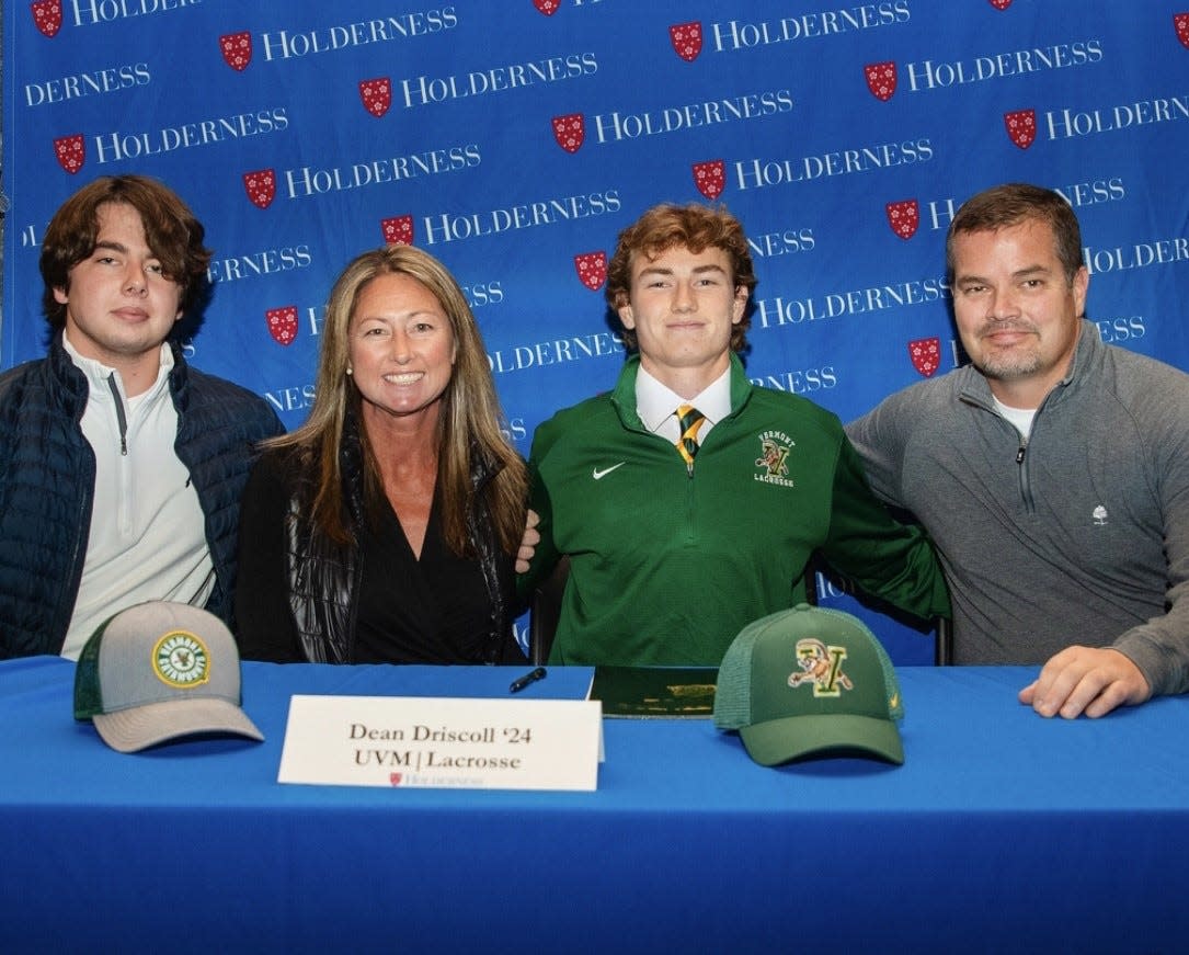 Dean Driscoll, third from left, recently signed her letter of commitment to play men's lacrosse at the University of Vermont. Driscoll is pictured with his brother, Evan; his mother, Natasha; and his father, Tim.