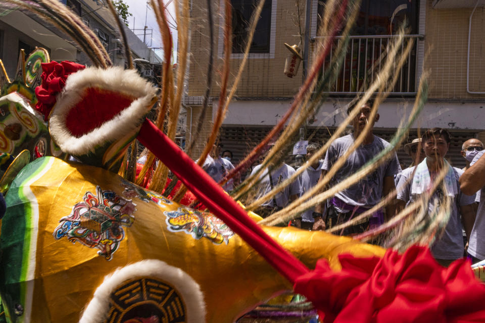 Participants take part in the Piu Sik Parade at the Bun Festival in Cheung Chau Island in Hong Kong, Friday, May 26, 2023. (AP Photo/Louise Delmotte)