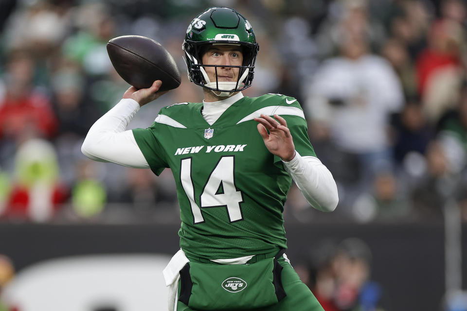 New York Jets quarterback Trevor Siemian (14) passes against the Washington Commanders during the fourth quarter of an NFL football game, Sunday, Dec. 24, 2023, in East Rutherford, N.J. (AP Photo/Adam Hunger)