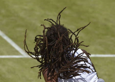 Dustin Brown of Germany serves during his match against Viktor Troicki of Serbia at the Wimbledon Tennis Championships in London, July 4, 2015. REUTERS/Toby Melville