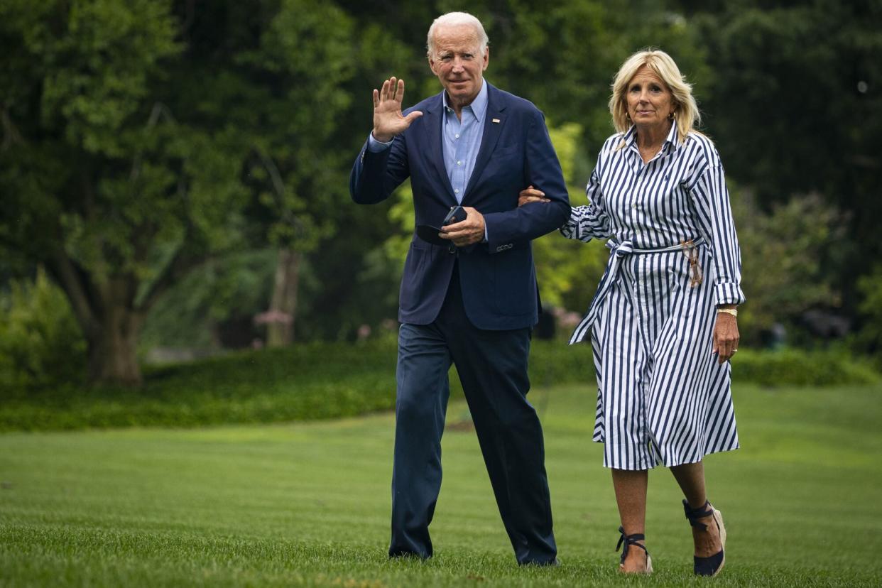 US President Joe Biden and First Lady Jill Biden walk on the South Lawn of the White House after arriving on Marine One in Washington, D.C., US, on Monday, Aug. 8, 2022. Biden resumed official travel today for the first time since his bout with Covid-19, traveling to Kentucky to show federal support for the state's recovery from historic flooding and to console survivors of the devastation. Photographer: Al Drago/Bloomberg via Getty Images