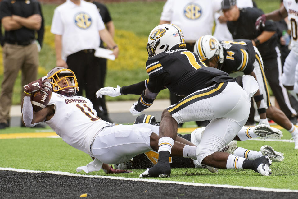 Central Michigan wide receiver JaCorey Sullivan, left, scores a touchdown past Missouri's Devin Nicholson, right, during the first half of an NCAA college football game Saturday, Sept. 4, 2021, in Columbia, Mo. (AP Photo/L.G. Patterson)