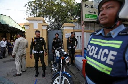 Military Police monitor outside the Sisowath High School during the final examinations in central Phnom Penh, Cambodia, August 22, 2016. REUTERS/Samrang Pring