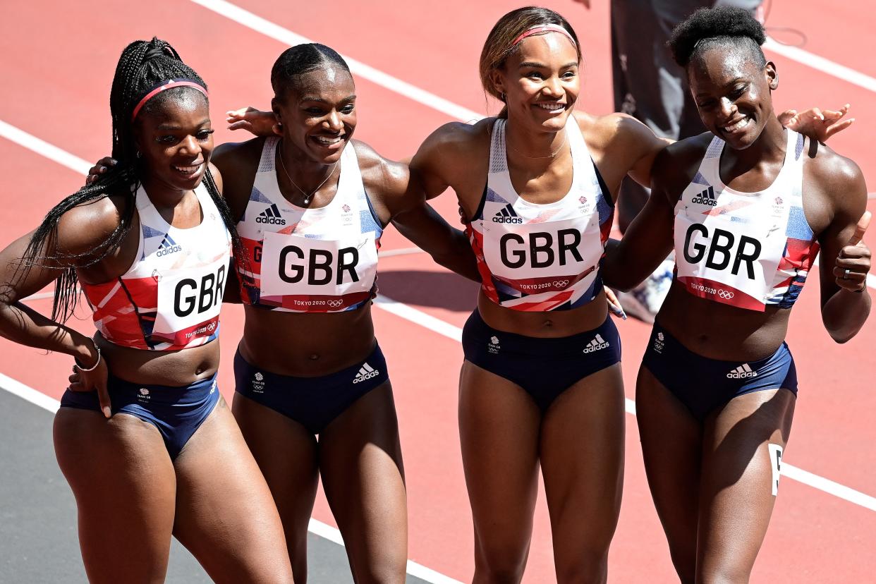 Britain's Asha Philip, Britain's Dina Asher-Smith, Britain's Imani Lansiquot and Britain's Daryll Neita pose after winning in the women's 4x100m relay heats during the Tokyo 2020 Olympic Games at the Olympic Stadium in Tokyo on August 5, 2021.  (AFP via Getty Images)