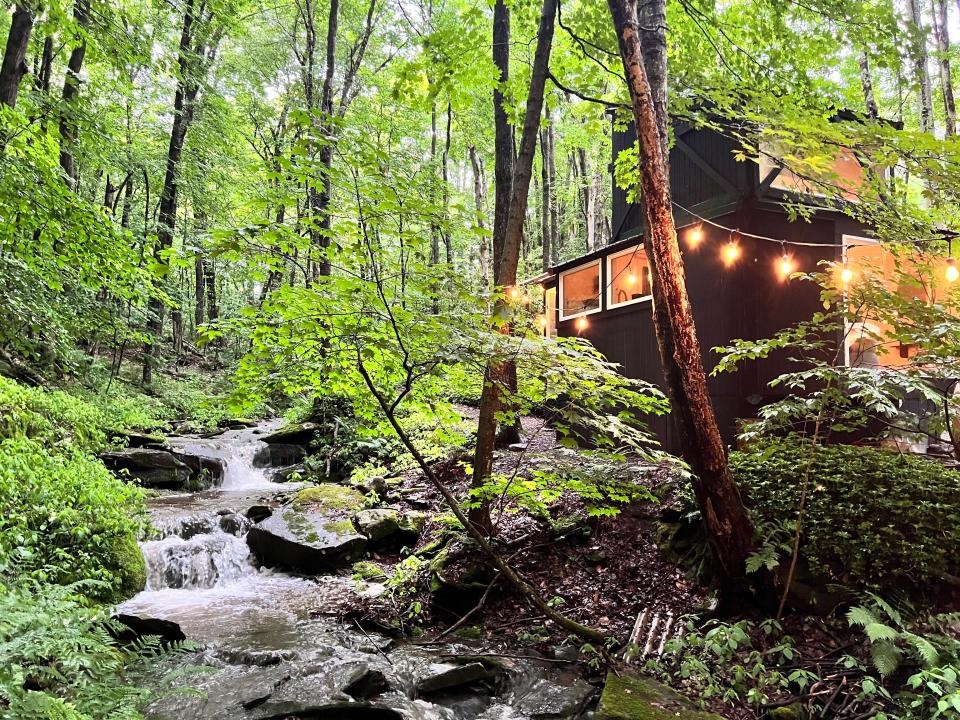 A stream, fairylights and the cabin.