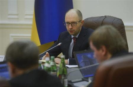 Ukraine's new prime minister Arseny Yatseniuk chairs a meeting in Kiev February 27, 2014. REUTERS/Andrew Kravchenko/Pool