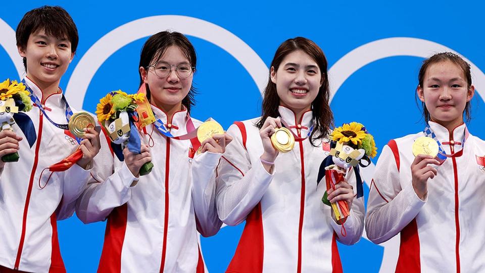 A Chinese women's swimming relay team is pictured after receiving their gold medals from the 200-metre event at the 2021 Tokyo Olympics. The 30-member team team earned six medals, including three gold. (Odd Andersen/AFP via Getty Images/File - image credit)