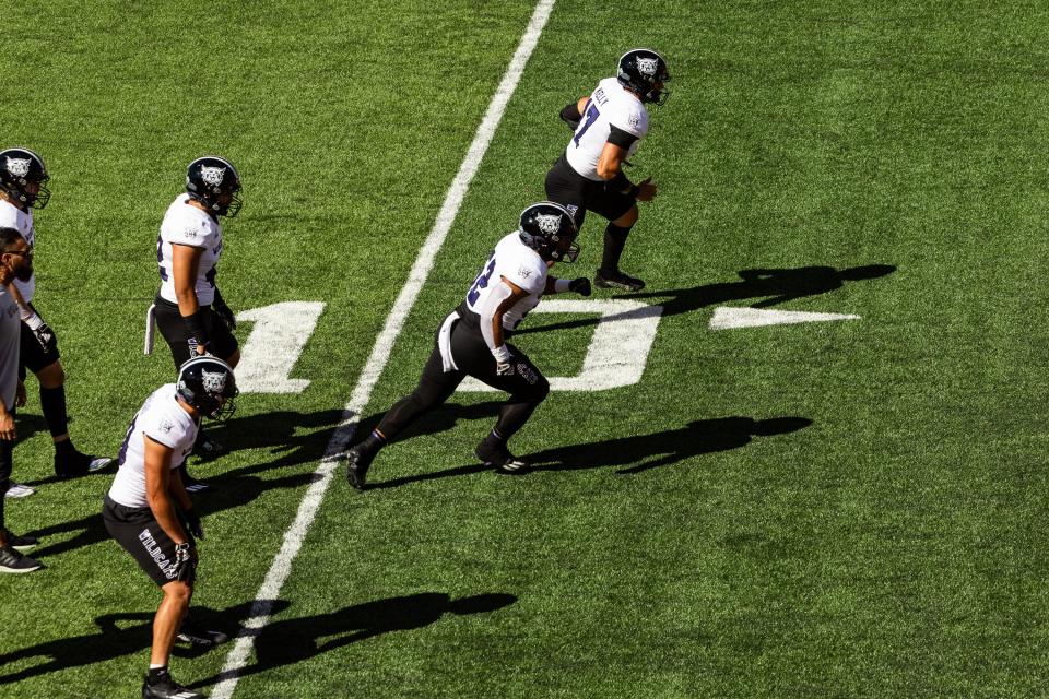 Weber State’s football team warms up before their game against Utah at Rice-Eccles Stadium in Salt Lake City on Saturday, Sept. 16, 2023. | Megan Nielsen, Deseret News