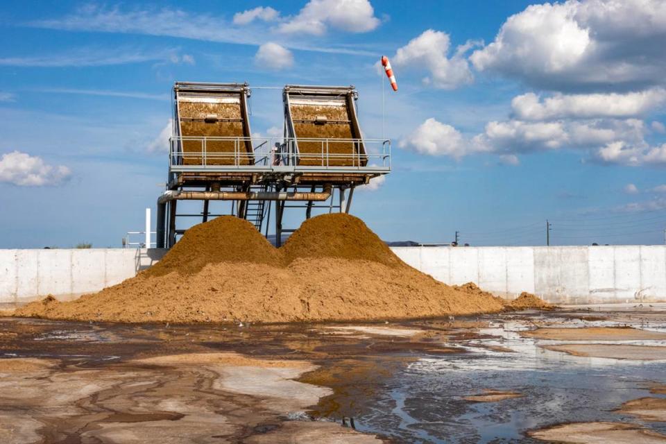 After manure spends time in the digester, the remaining material is run through a composter that squeezes out the liquid and solids to use as fertilizer on the farm.