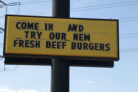 FILE PHOTO: A sign advertising hamburgers made with fresh beef is seen at a McDonald's restaurant in Dallas, Texas, U.S. April 18, 2017. REUTERS/Liz Hampton/File Photo