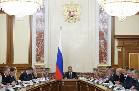 Russian Prime Minister Dmitry Medvedev chairs a meeting of the cabinet on changes in the tax system and in the pension system in Moscow, Russia June 14, 2018. Picture taken June 14, 2018. Sputnik/Dmitry Astakhov/Pool via REUTERS