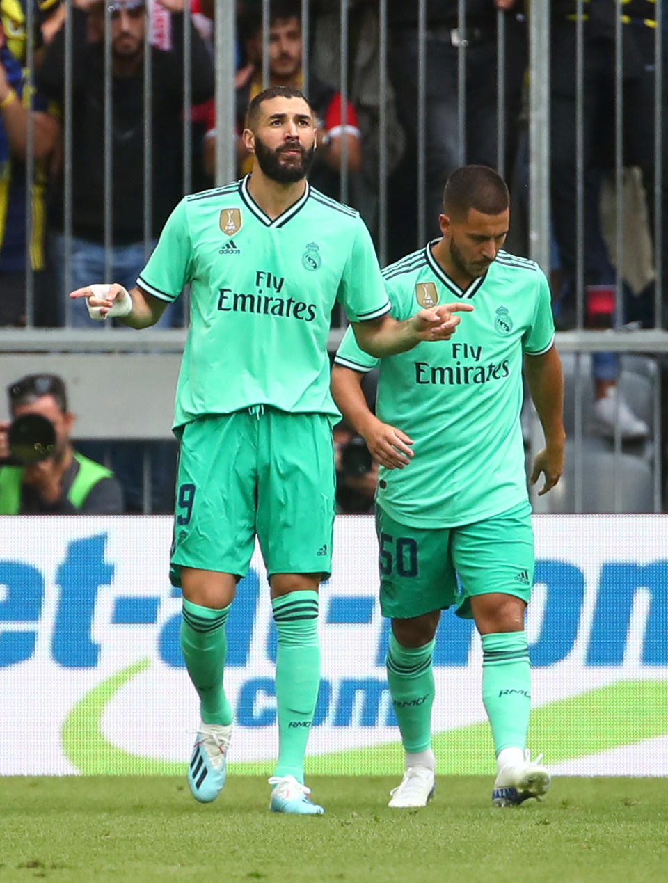 Soccer Football - Audi Cup - Third Place Play Off - Real Madrid v Fenerbahce - Allianz Arena, Munich, Germany - July 31, 2019  Real Madrid's Karim Benzema celebrates scoring their first goal with Eden Hazard   REUTERS/Michael Dalder