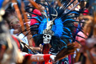 <p>Participants are seen during the traditional Day of the Dead parade at Reforma Avenue in Mexico City, Mexico on Oct. 28, 2017. (Photo: Carlos Tischler/REX/Shutterstock) </p>