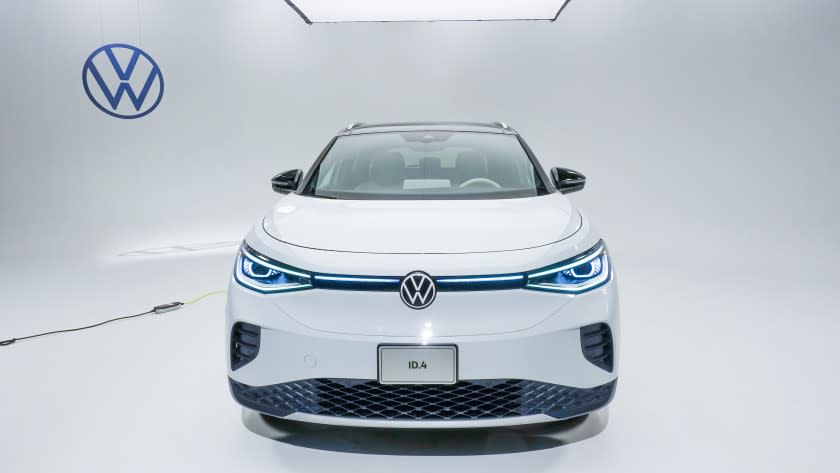 Volkswagen's ID.4 all-electric compact SUV shown from the front, photographed in a well lit studio