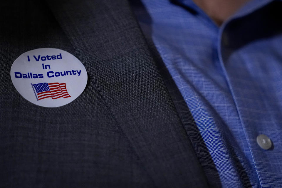 A supporter of U.S. Senate hopeful Colin Allred, D-Texas, wears an "I Voted in Dallas County" sticker during an election night gathering, Tuesday, March 5, 2024, in Dallas. (AP Photo/Julio Cortez)