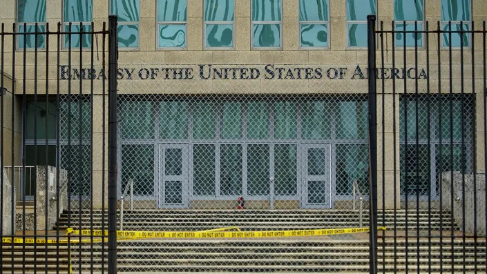 The U.S. Embassy in Havana with a fence and caution tape blocking the entrance.