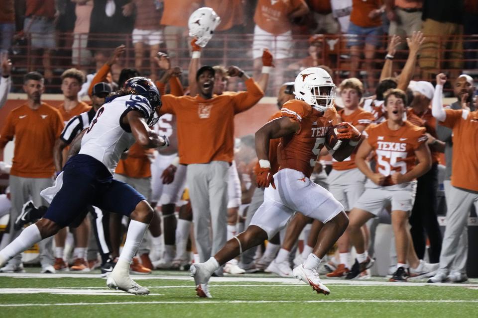 Texas running back Bijan Robinson scores on a 78-yard touchdown run against West Virginia on Sept. 17, tied for the longest run of his Longhorns career. Robinson finished with 183 yards and three touchdowns in the 41-20 victory.