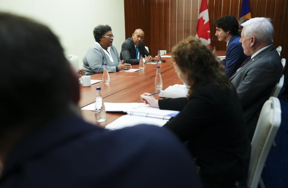 Prime Minister Justin Trudeau and Canadian Ambassador to the United Nations Bob Rae take part in a bilateral with Prime Minister of Barbados Mia Mottley during the Conference of Heads of Government of the Caribbean Community (CARICOM) in Nassau, Bahamas, on Thursday, Feb. 16, 2023. (Sean Kilpatrick /The Canadian Press via AP)