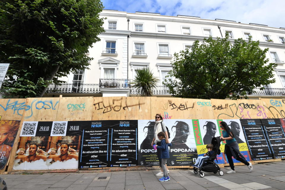 Properties are boarded up along the carnival route (PA)