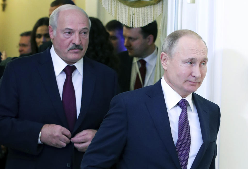 FILE In this file photo taken on Friday, Dec. 20, 2019, Russian President Vladimir Putin, right, and Belarusian President Alexander Lukashenko walk before a meeting of the Supreme Eurasian Economic Council in St. Petersburg, Russia. Russia has halted oil supplies to Belarus after the two countries failed to renegotiate a contract amid talks of further improving their economic ties. (Mikhail Klimentyev, Sputnik, Kremlin Pool Photo via AP, File)