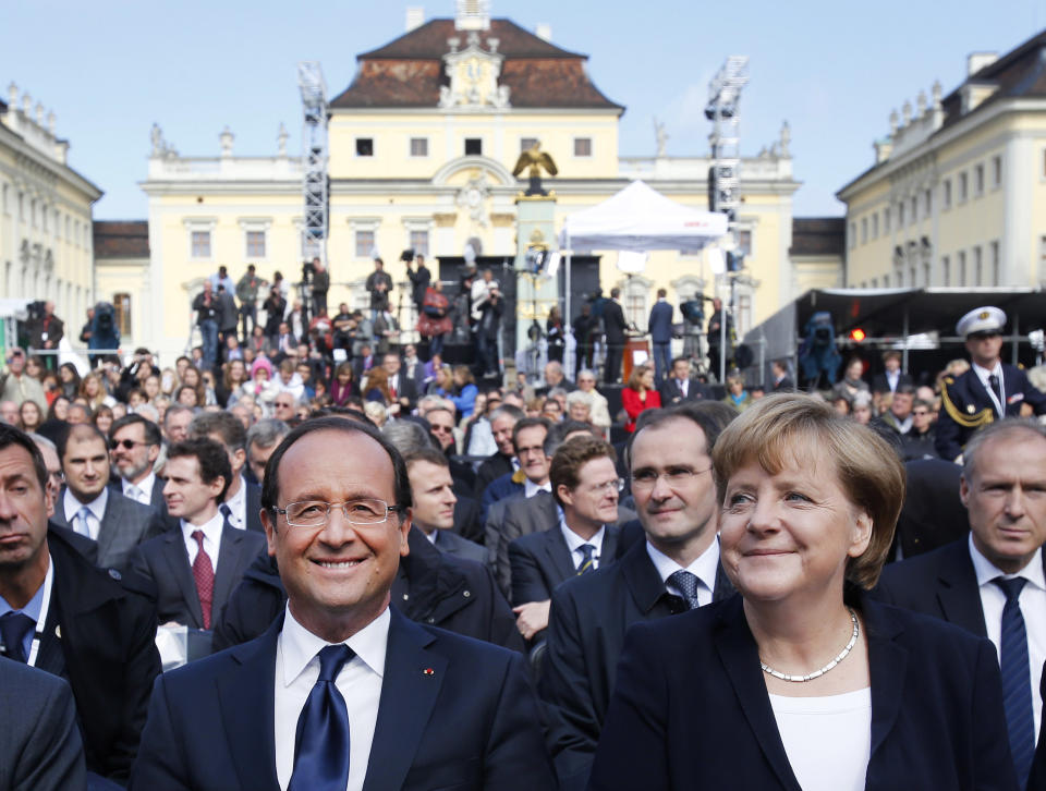 German Chancellor Angela Merkel, right, and French President Francois Hollande, at the castle in Ludwigsburg, Germany, Saturday, Sept. 22, 2012. The leaders of France and Germany are meeting to celebrate an anniversary of their countries' reconciliation following the end of World War II. French President Francois Hollande travelled to the southwestern German city of Ludwigsburg on Saturday to meet with Chancellor Angela Merkel to commemorate the speech France's then-leader Charles de Gaulle gave there 50 years ago. (AP Photo/Michael Probst)