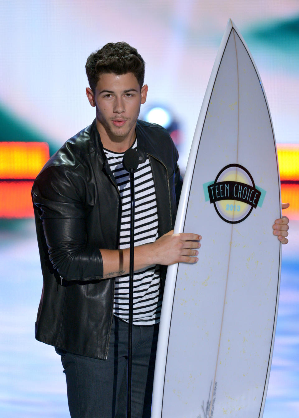 Nick Jonas accepts the inspire award at the Teen Choice Awards at the Gibson Amphitheater on Sunday, Aug. 11, 2013, in Los Angeles. (Photo by John Shearer/Invision/AP)