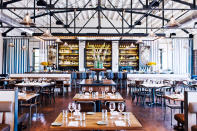 <div class="caption-credit">Photo by: Andrew Thomas Lee</div><div class="caption-title">The Optimist, Atlanta</div><p> <b>A soaring, convivial spot,</b> the Optimist has a hopping oyster bar shaped like a surfboard, a first-rate cocktail program, and seafood cooked with old-school expertise over a wood fire. </p> <p> Start with the grandness of the space - its inspiration taken from a vintage photo of a seafood plant in Savannah. The main dining room, with a white wooden ceiling trussed with steel rods and a wall of wine and spirits behind a waxed-steel bar counter, seats 180, with booths covered in a gold wet-suit fabric. Every table is taken every night. <br> <b><br> MORE FROM ESQUIRE: <br></b> <b><a href="http://www.esquire.com/features/food-drink/best-power-meals-1012?link=rel&dom=yah_life&src=syn&con=blog_esq&mag=esq" rel="nofollow noopener" target="_blank" data-ylk="slk:America's Best Power Lunches;elm:context_link;itc:0;sec:content-canvas" class="link ">America's Best Power Lunches</a></b> <br> <b><a href="http://www.esquire.com/features/food-drink/fine-dining-etiquette?link=rel&dom=yah_life&src=syn&mag=esq" rel="nofollow noopener" target="_blank" data-ylk="slk:25 Sexy Dating Rules Every Man Should Follow;elm:context_link;itc:0;sec:content-canvas" class="link ">25 Sexy Dating Rules Every Man Should Follow</a><br></b> </p>