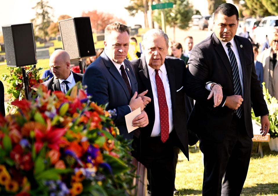 President Jeffrey R. Holland, acting president of the Quorum of the Twelve Apostles of The Church of Jesus Christ of Latter-day Saints, pauses for a moment and looks back at the casket of President M. Russell Ballard’s during his graveside service in the Salt Lake City Cemetery on Friday, Nov. 17, 2023. | Scott G Winterton, Deseret News