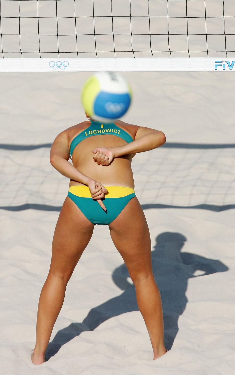 ATHENS - AUGUST 14: Summer Lochowicz of Australia signals to her teammate during their match against China in the women's preliminary match on August 14, 2004 during the Athens 2004 Summer Olympic Games at the Olympic Beach Volleyball Centre at the Faliro Coastal Zone Complex in Athens, Greece. Australia won 21-18, 21-18. (Photo by Stuart Franklin/Getty Images)