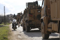 Turkish military convoy stops in Idlib province, Syria, Saturday, Feb. 22, 2020. A Turkish soldier was killed in Syria's northwest Idlib province, state-run Anadolu news agency reported Saturday. (AP Photo/Ghaith Alsayed)