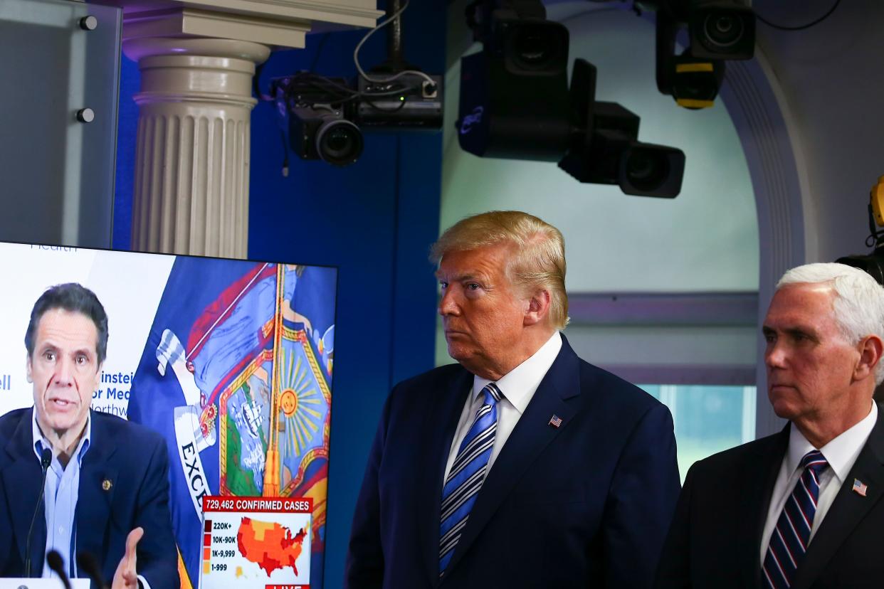 President Donald Trump, with Vice President Mike Pence, watches a clip of New York Gov. Andrew Cuomo at the daily coronavirus briefing. Trump's Department of Justice was accused of politicizing the pandemic when it targeted nursing home data in four states with Democratic governors, including New York. (Photo: Tasos Katopodis/Getty Images)